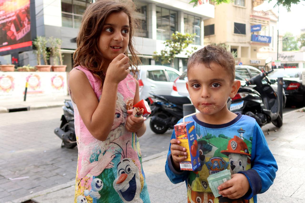 Syrian brother and sister beg in a street of Beirut, Lebanon