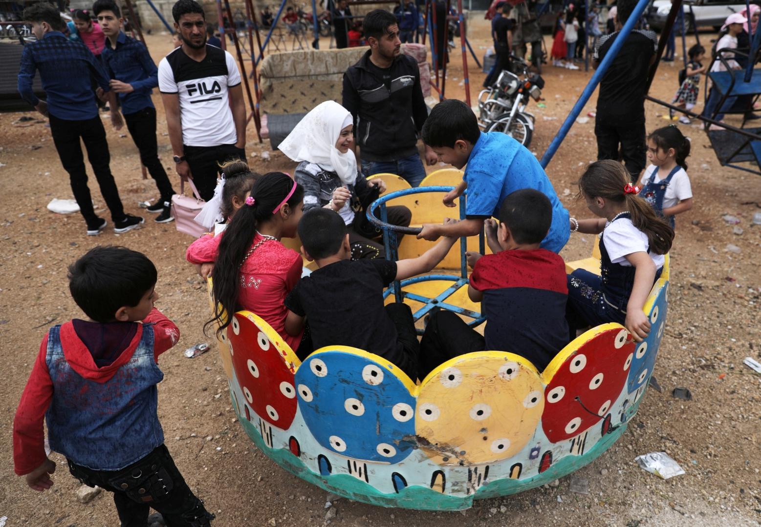 Children play at a makeshift amusement park to celebrate the Muslim holiday of Eid al-Fitr in Idlib city Children play at a makeshift amusement park to celebrate the Muslim holiday of Eid al-Fitr, amid the global outbreak of the coronavirus disease (COVID-19), in the opposition-held Idlib city in northwest Syria, May 24, 2020. REUTERS/Khalil Ashawi KHALIL ASHAWI