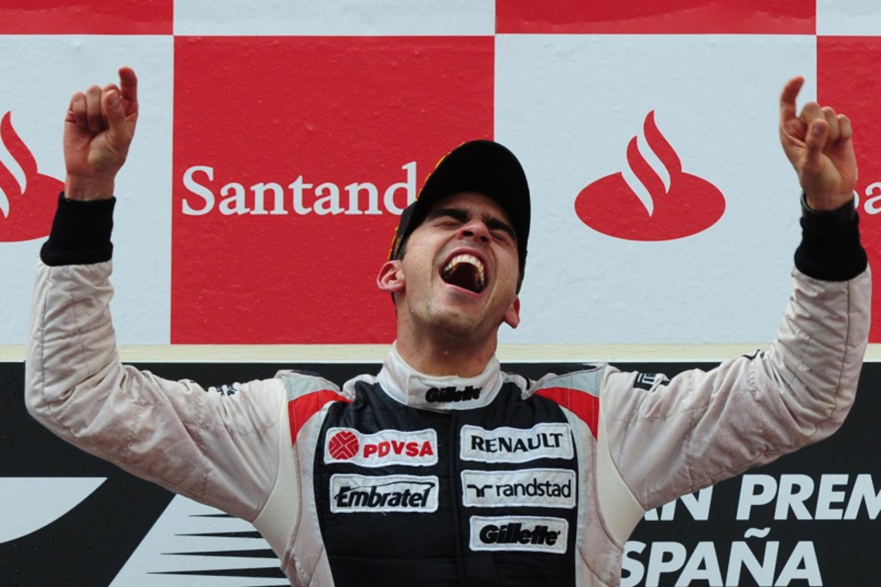 'William\'s Venezuelan driver Pastor Maldonado celebrates on the podium at the Circuit de Catalunya on May 13, 2012 in Montmelo on the outskirts of Barcelona during the Spanish Formula One Grand Prix.