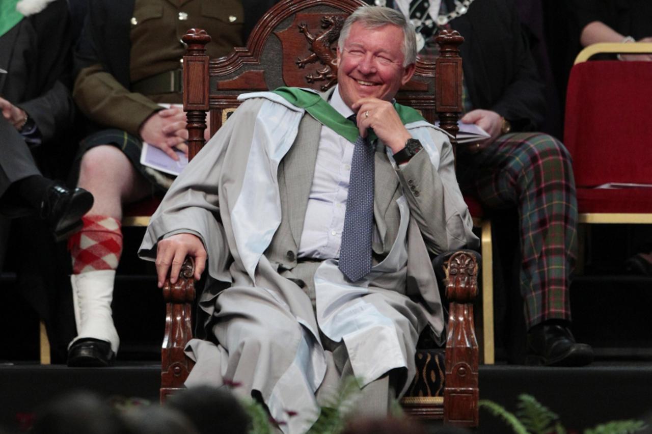 'Manchester United soccer team manager Alex Ferguson smiles before being awarded an honorary doctorite degree during a graduation ceremony at Stirling University in Stirling, Scotland June 29, 2011. R