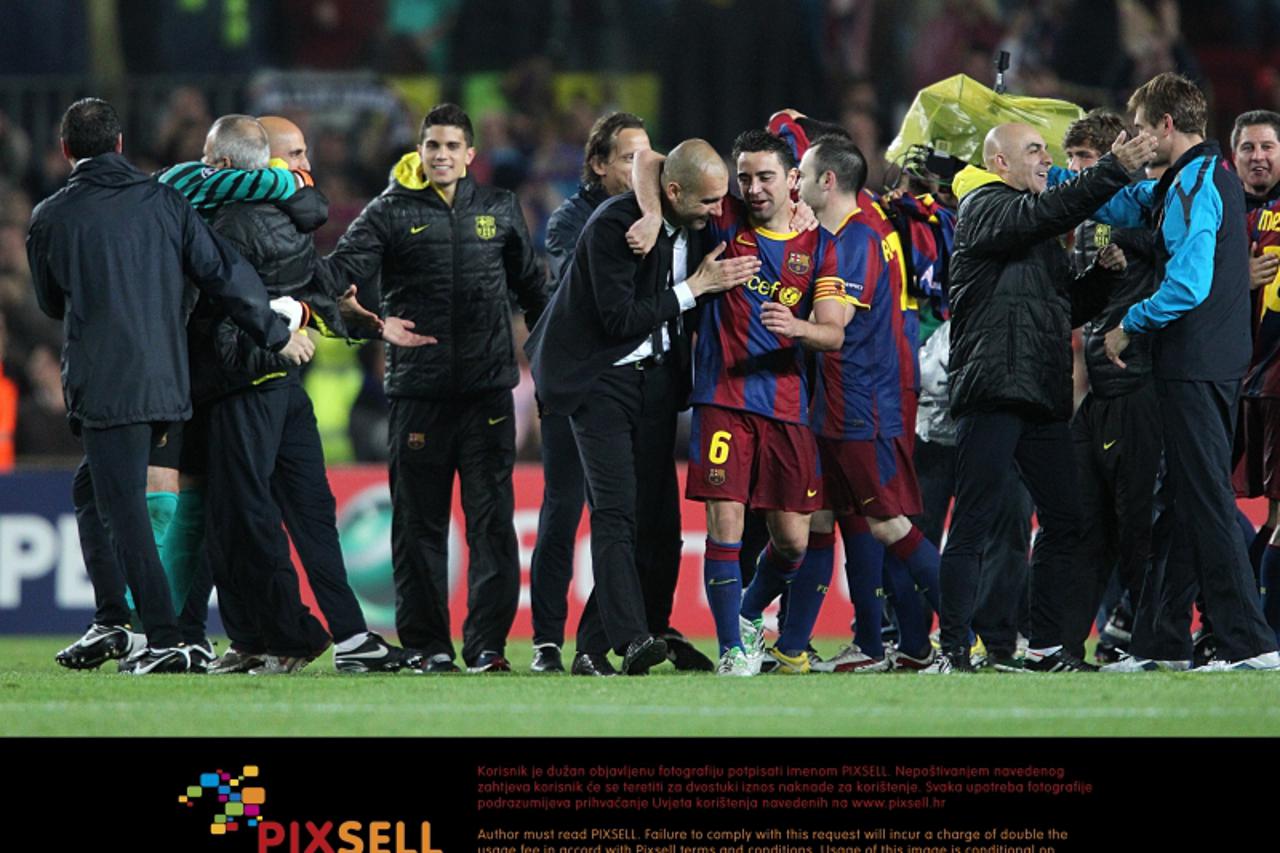 'Barcelona manager Pep Guardiola (centre) celebrates with Xavi after the final whistle Photo: Press Association/Pixsell'