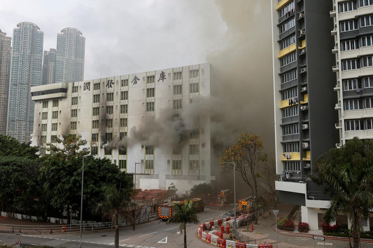 A blaze is seen at a warehouse in the city's bustling Kowloon district, in Hong Kong