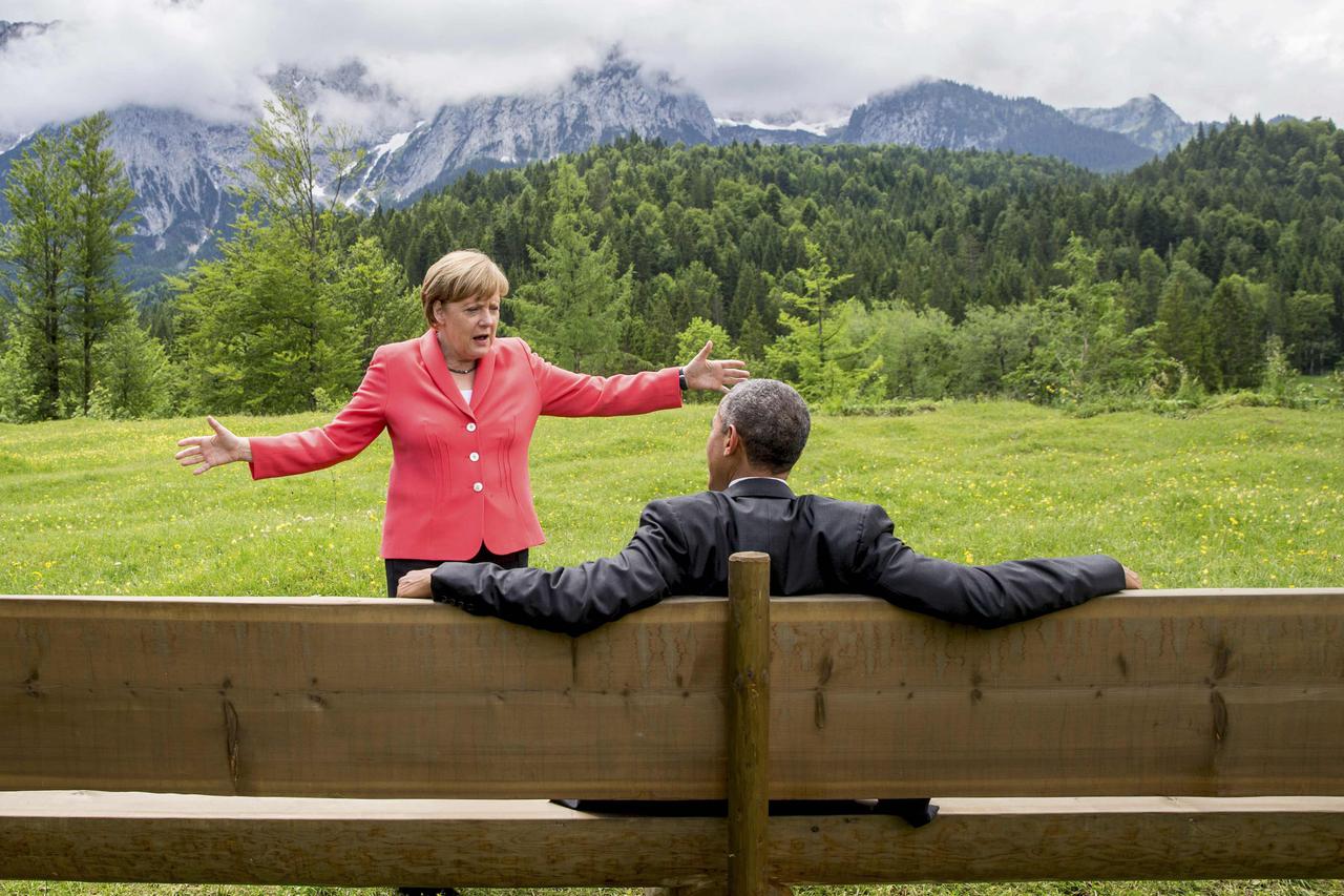 German Chancellor Angela Merkel speaks with U.S. President Barack Obama outside the Elmau castle in Kruen near Garmisch-Partenkirchen, Germany, June 8, 2015. Leaders of the Group of Seven (G7) industrial nations vowed at a summit in the Bavarian Alps on S