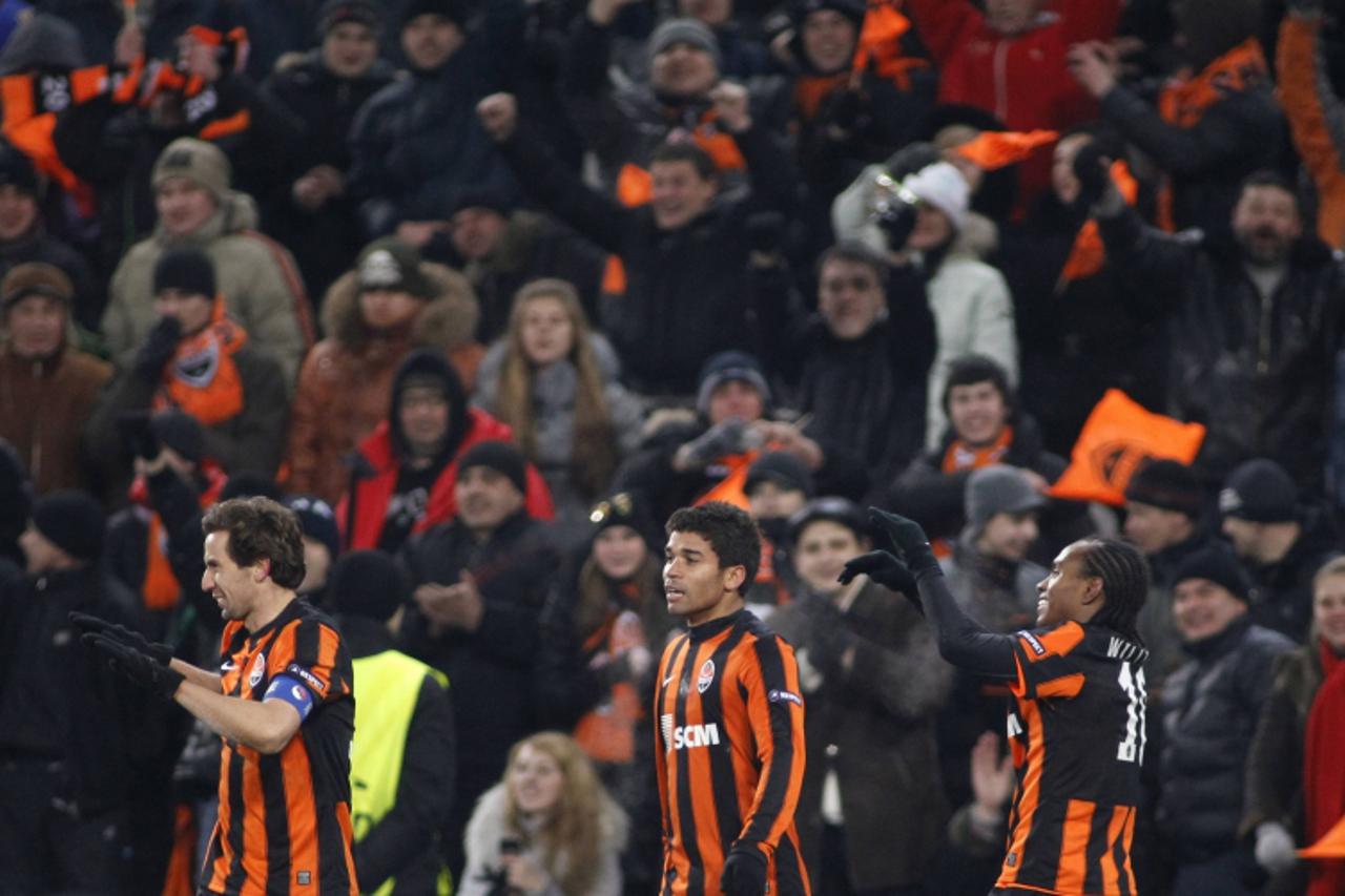 'Shakhtar Donetsk\'s Eduardo (C), Darijo Srna (L) and Willian celebrate after scoring against AS Roma during their Champions League soccer match at the Donbass Arena stadium in Donetsk March 8, 2011. 