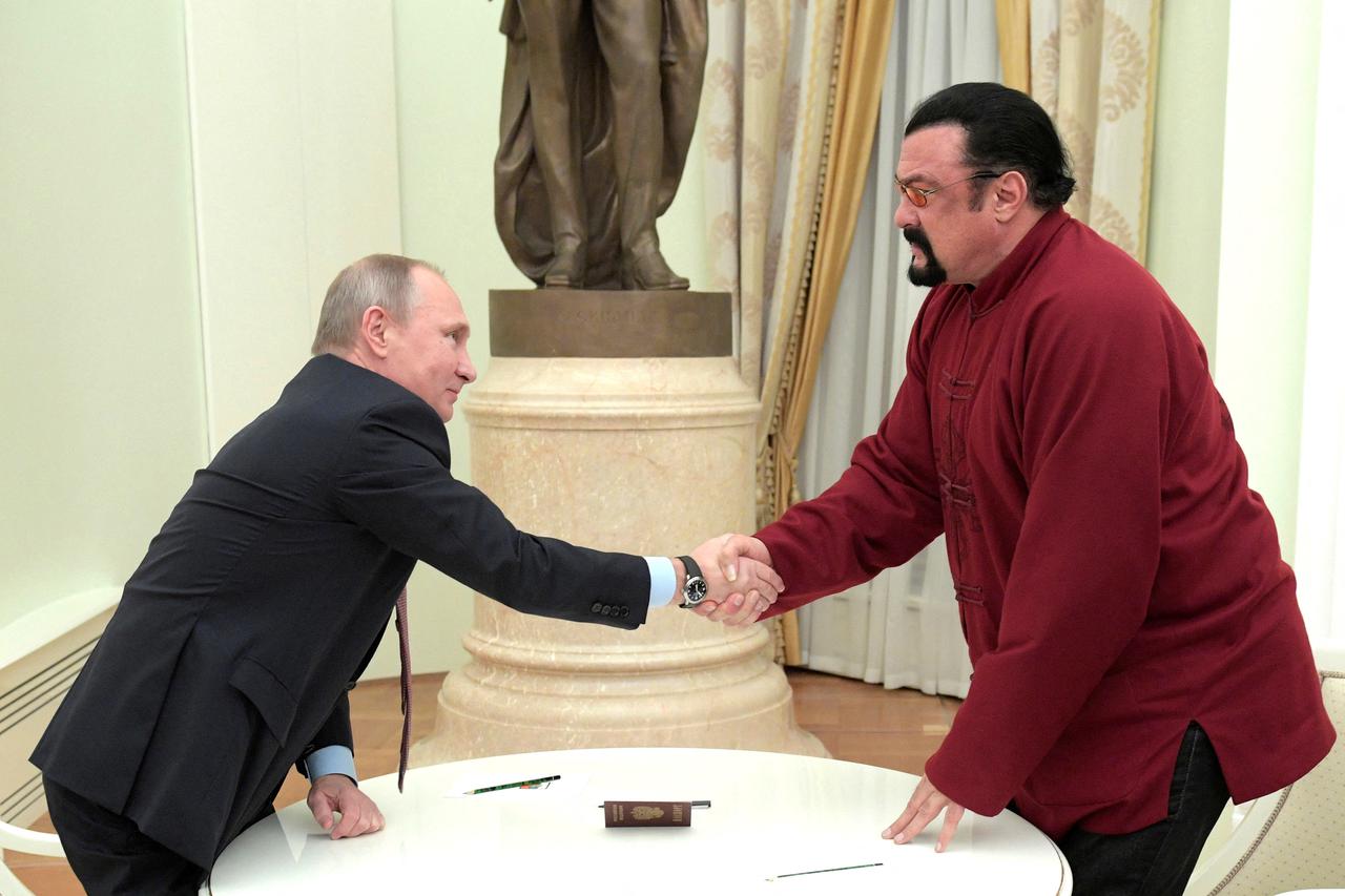 FILE PHOTO: Russia's President Putin meets U.S. actor Seagal in Moscow