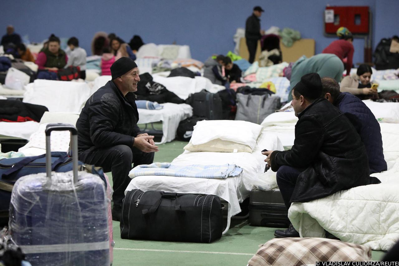 People fleeing Russia's invasion of Ukraine rest in a temporary refugee centre in Chisinau