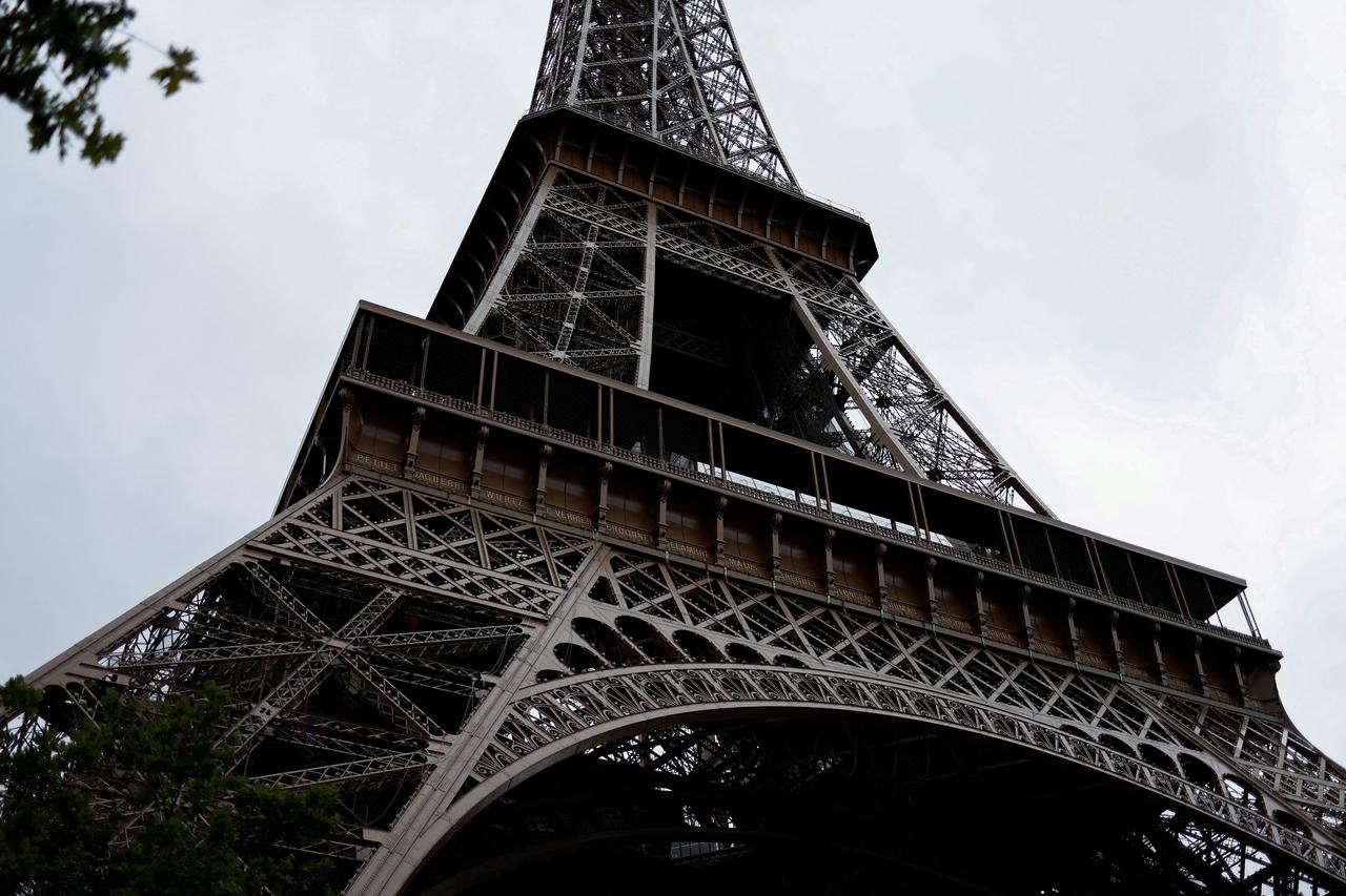 FILE PHOTO: Tourists visit the Eiffel Tower in Paris