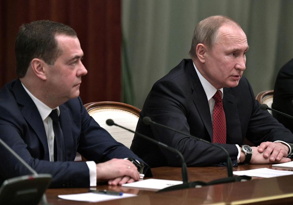 FILE PHOTO: Russian President Putin and Prime Minister Medvedev attend a meeting with members of the government in Moscow