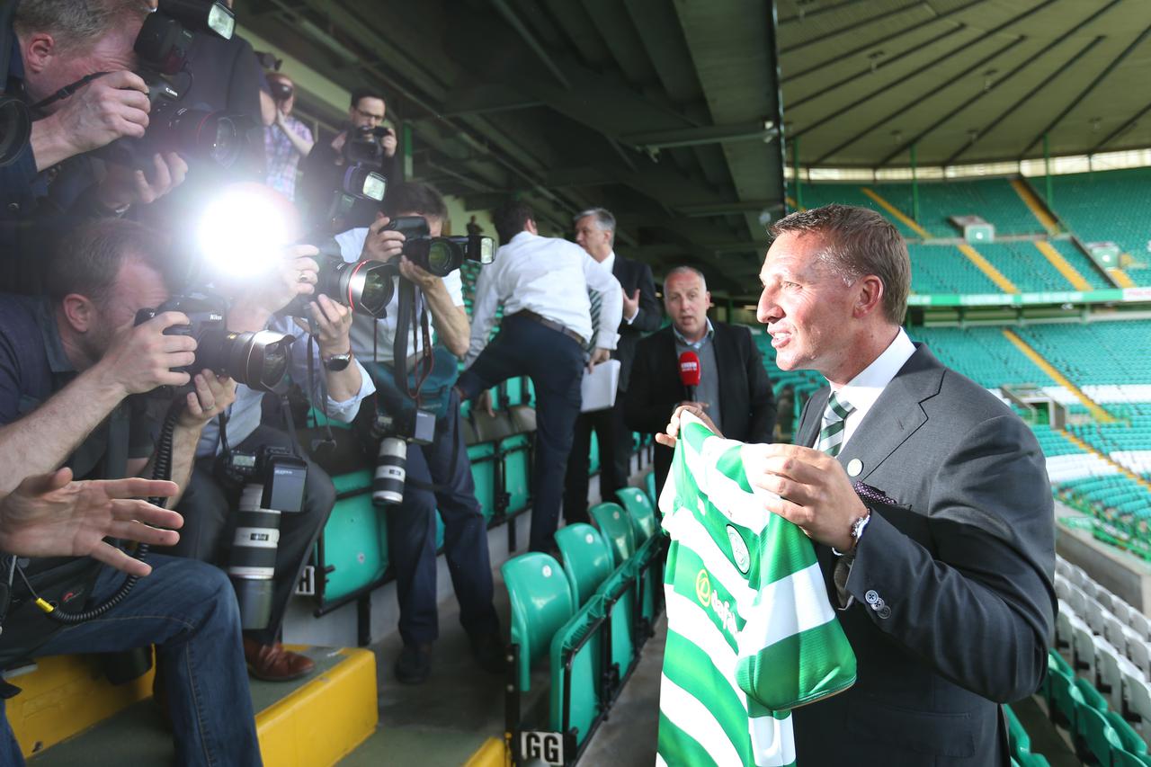 Celtic - Brendan Rodgers Press ConferenceBritain Football Soccer - Celtic - Brendan Rodgers Press Conference - Celtic Park - 23/5/16 New Celtic manager Brendan Rodgers poses with the Celtic shirt after the press conference Reuters / Russell Cheyne Livepic