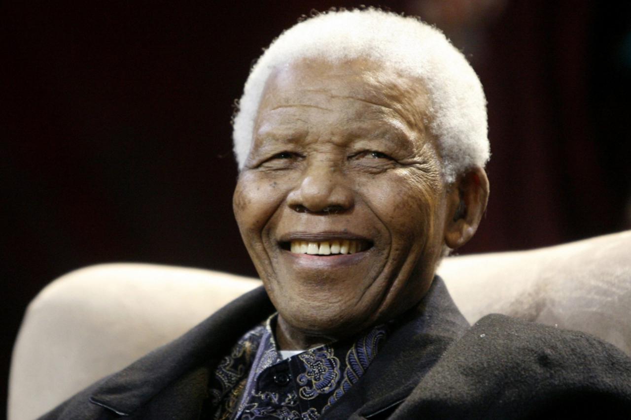 'Former President Nelson Mandela attends the sixth Annual Nelson Mandela lecture in Kliptown, in this July 12, 2008 file photo. The Nelson Mandela foundation sent out a statement on Wednesday saying f
