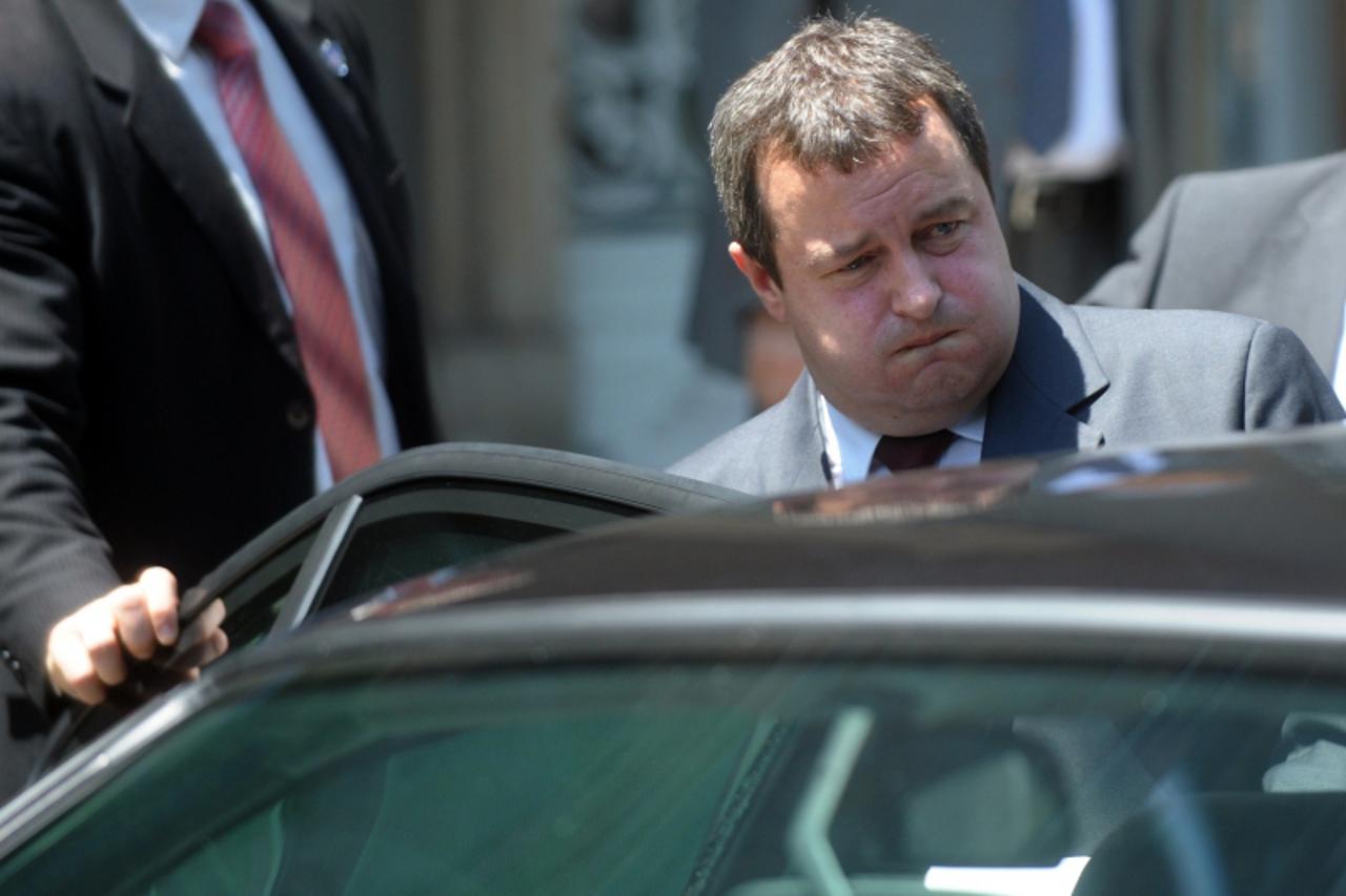 'Serbian Socialist leader Ivica Dacic enters his vehicle after his meeting with the Serbian President in Belgrade on June 28, 2012. Ivica Dacic received the mandate to form a government with the natio