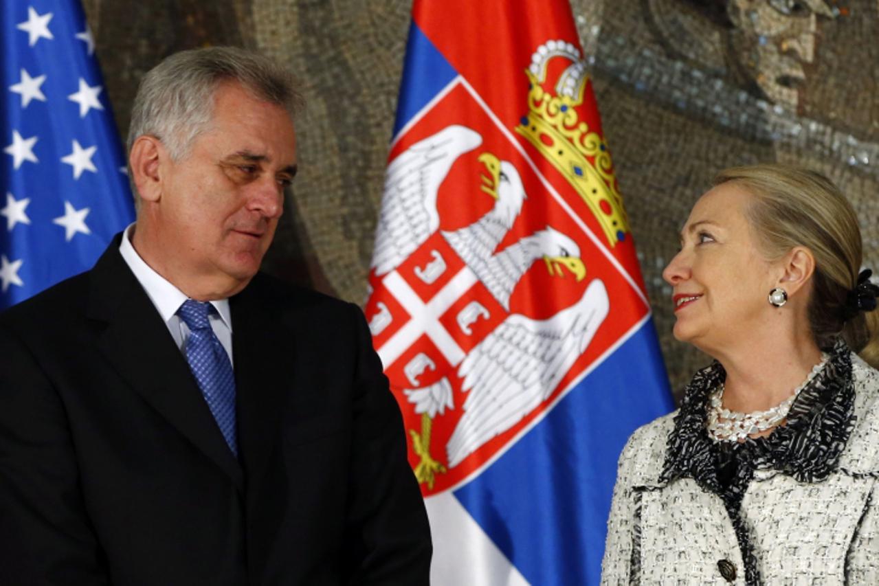 'U.S. Secretary of State Hillary Clinton (R) talks to Serbian President Tomislav Nikolic before their meeting in Belgrade October 30, 2012. Clinton and EU foreign policy chief Catherine Ashton began a