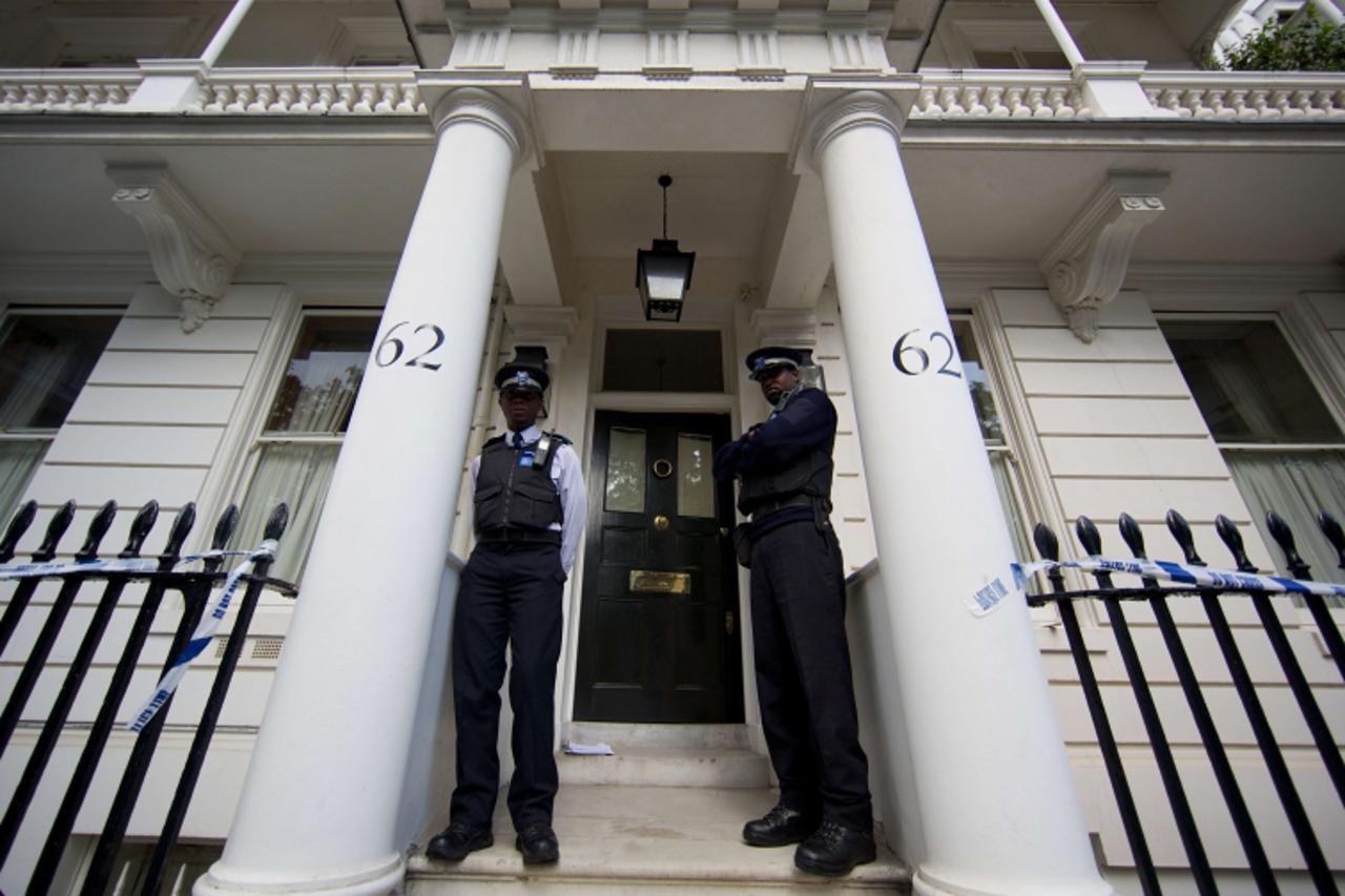 'British Police Community Support Officers are pictured outside the London home of Hans Kristian Rausing and his wife Eva on July 10, 2012. British police were on Wednesday investigating the mysteriou