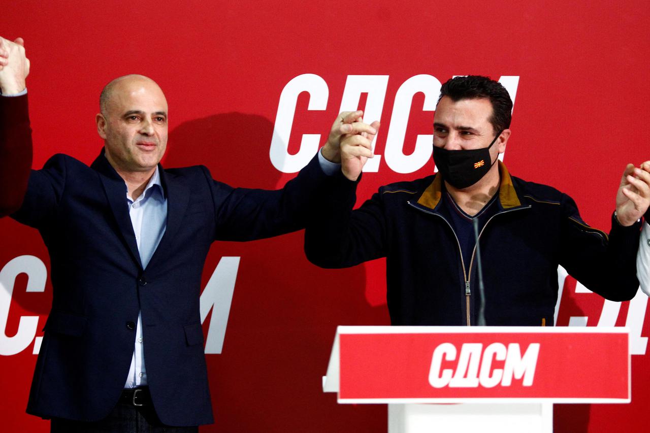 Newly elected leader of SDSM  Kovacevski celebrates his victory with his predecessor Prime Minister  Zaev in Skopje