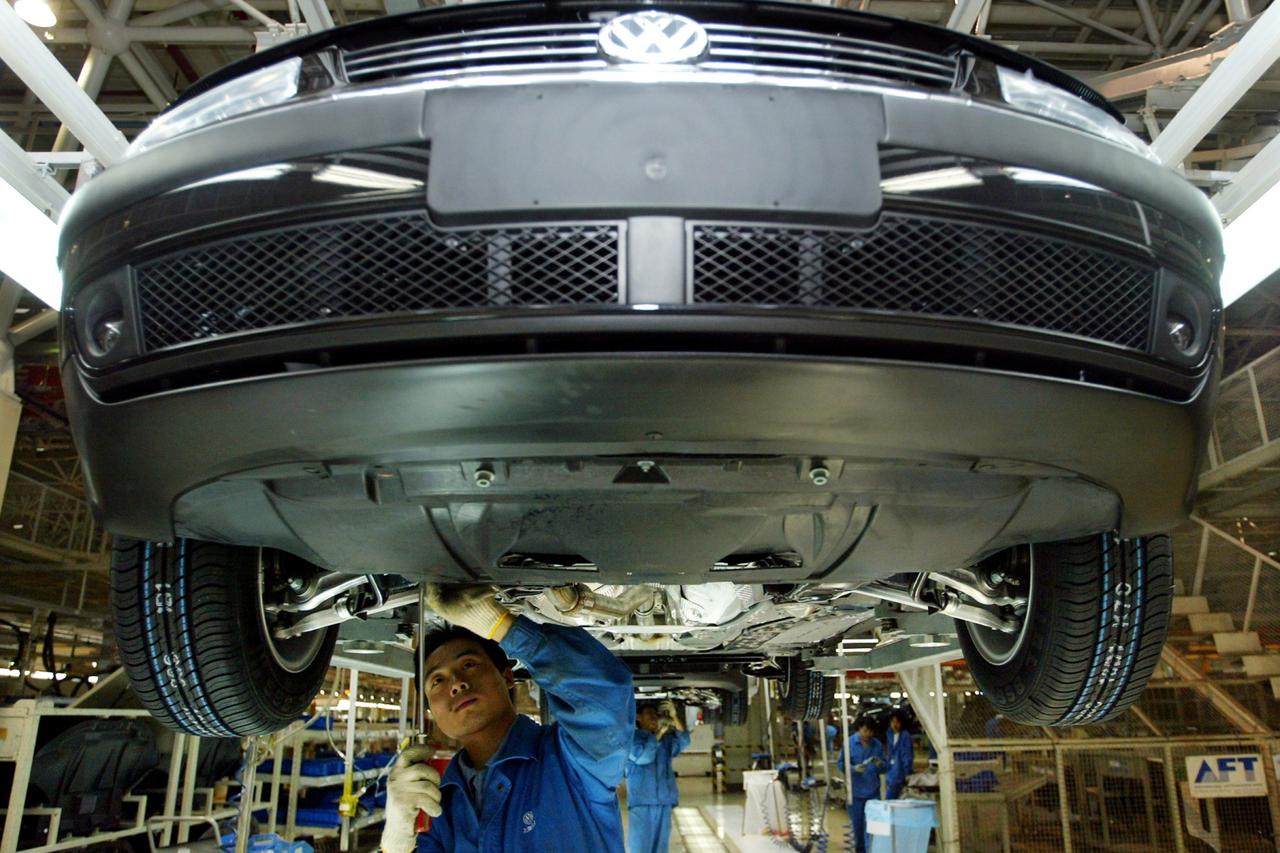 FILE PHOTO: CHINESE WORKERS ASSEMBLE A VOLKSWAGEN PASSAT IN SHANGHAI.