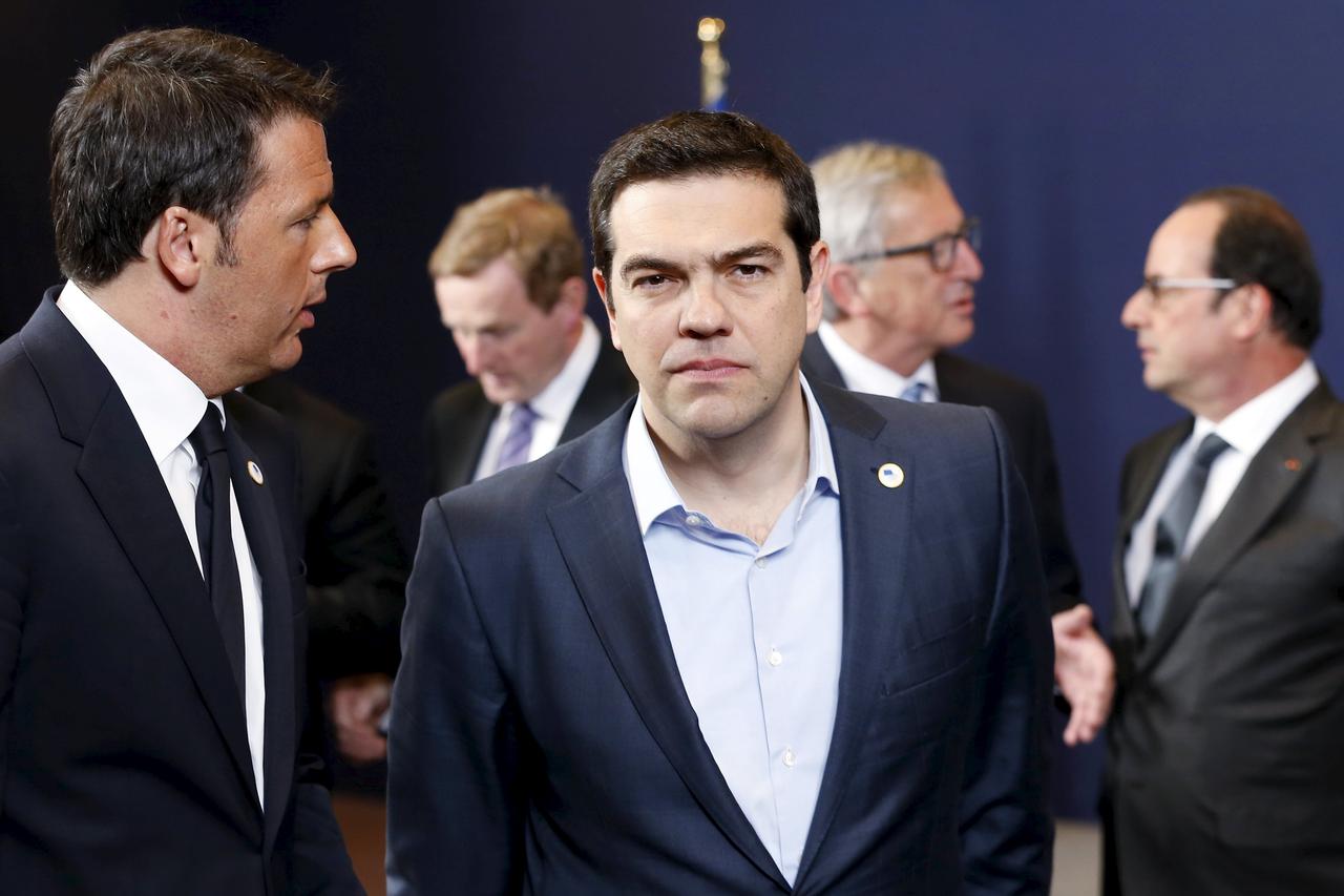 Italy's Prime Minister Matteo Renzi (front L-R) talks to his Greek counterpart Alexis Tsipras next to European Commission President Jean-Claude Juncker (back 2nd R) and France's President Francois Hollande (back R) during a European Union leaders summit i