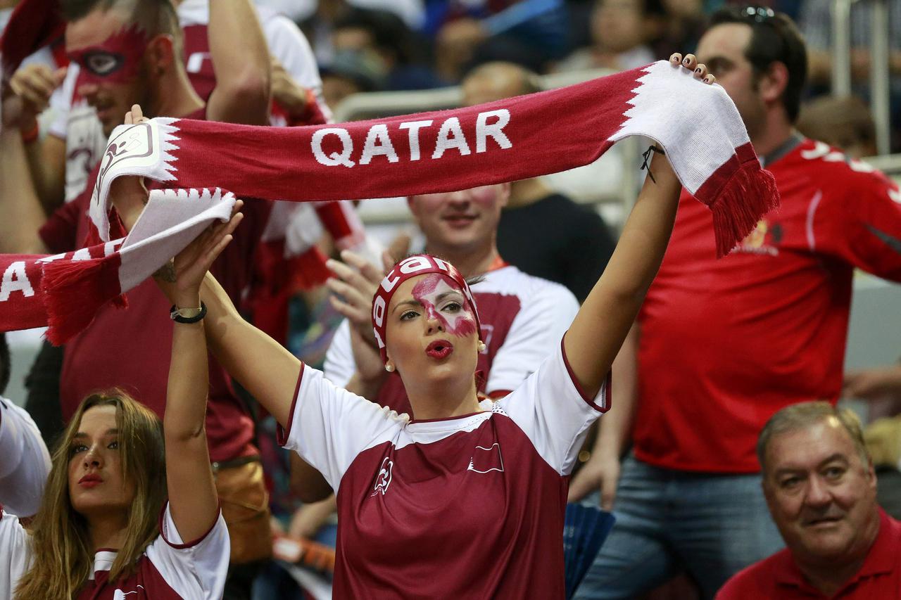 A fan of Qatar cheers before their semi-final match against Poland at the 24th Men's Handball World Championship in Doha January 30, 2015.    REUTERS/Mohammed Dabbous (QATAR  - Tags: SPORT HANDBALL)