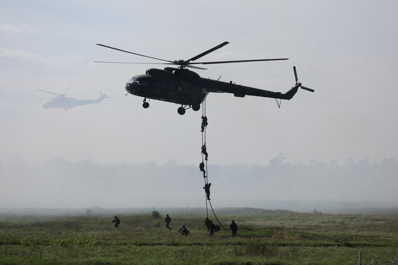 Polish soldiers land from Mi-8 helicopter during Defender Europe 2022 military exercise at the military range in Bemowo Piskie