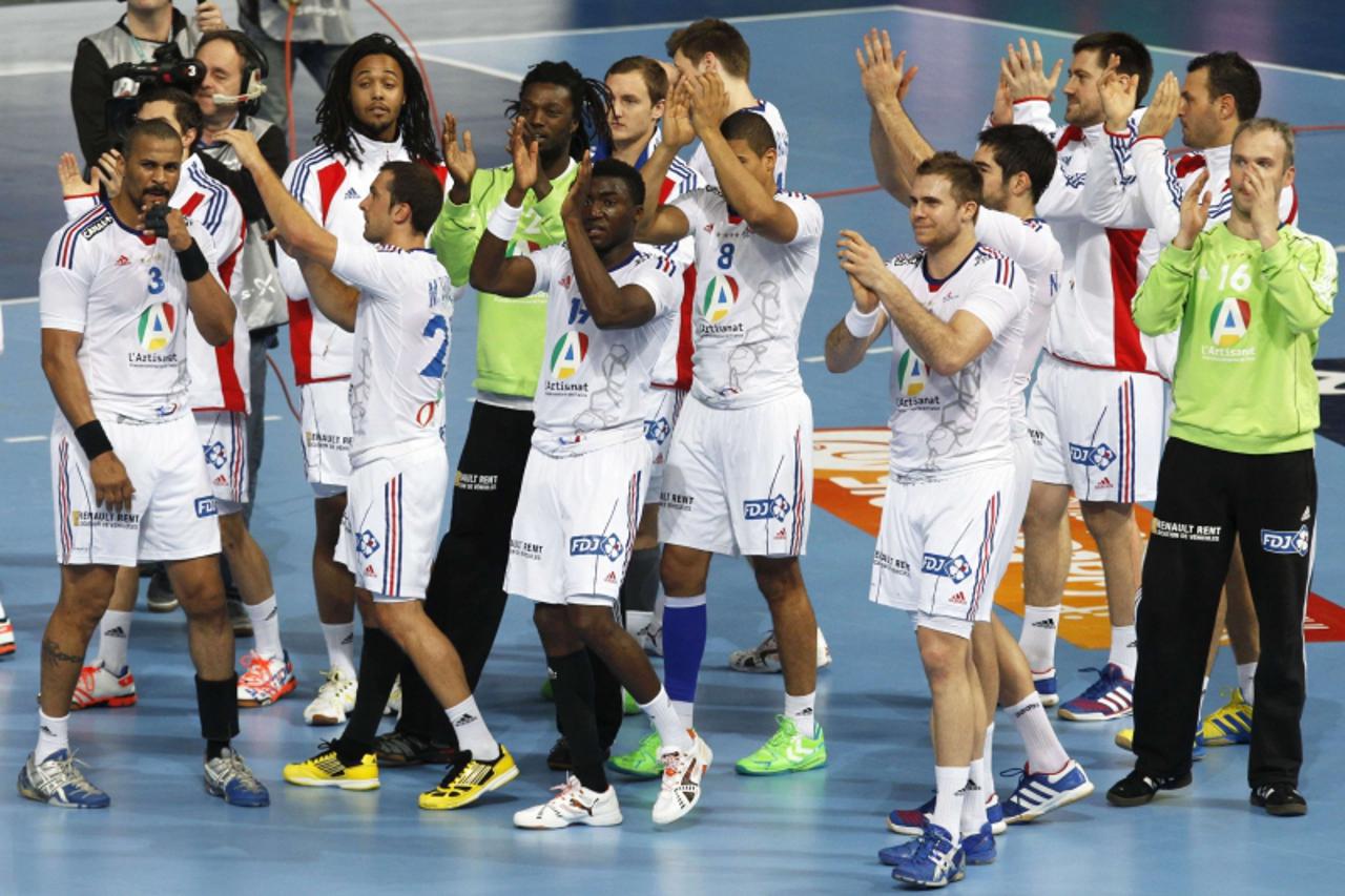 'France\'s players applaud their supporters after winning the match against Iceland\'s during the World Men\'s Handball Championship at Palau Sant Jordi arena in Barcelona January 20, 2013.     REUTER