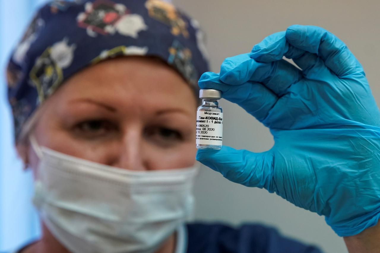 A nurse shows Russia's "Sputnik-V" vaccine against the coronavirus disease (COVID-19) prepared for inoculation in a post-registration trials stage at a clinic in Moscow