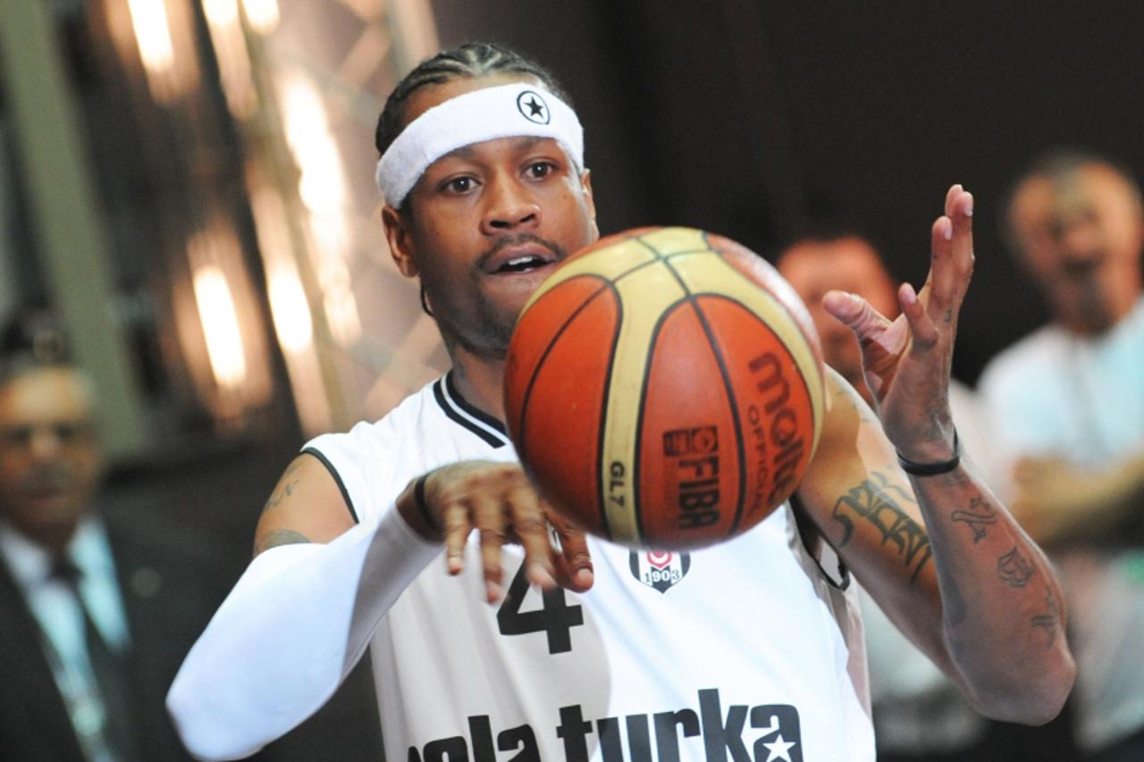 \'Former NBA star Allen Iverson  plays with a ball during a ceremony to celebrate his new contract with Turkish basket ball club Besiktas on November 9, 2010 in Istanbul . Eleven-time NBA all-star and