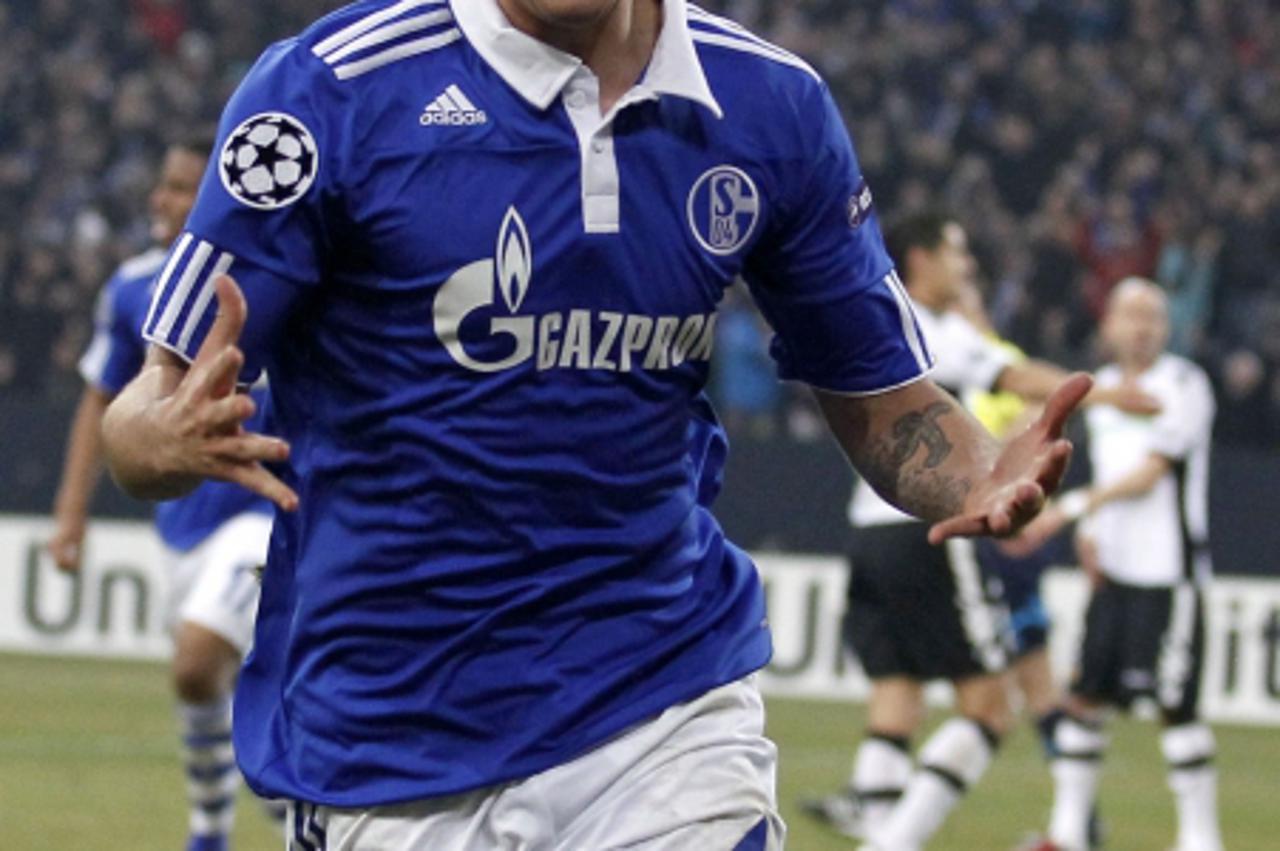 'Mario Gavranovic of Schalke 04 celebrates a goal against Valencia during their Champions League soccer match in Gelsenkirchen, March 9, 2011.   REUTERS/Kai Pfaffenbach (GERMANY - Tags: SPORT SOCCER)'