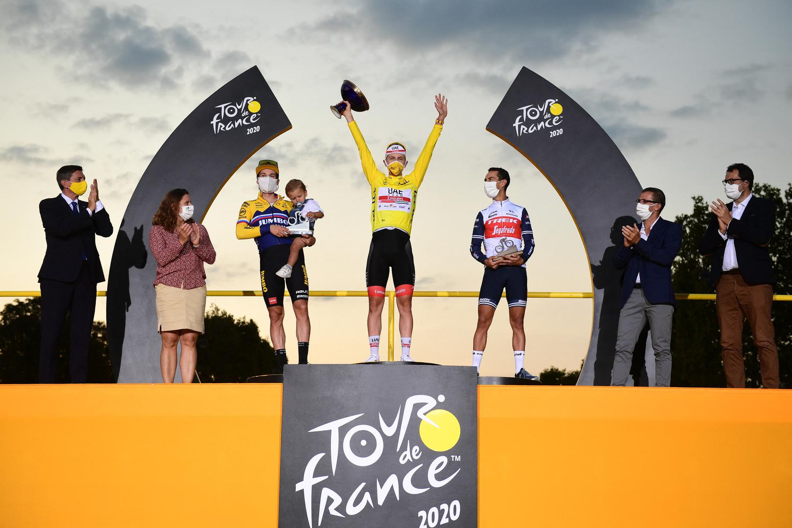 Tadej Pogacar wins Tour de France 2020 Handout. L-R, second Primoz Roglic of Team Jumbo - Visma , winner yellow jersey Slovenian Tadej Pogacar of UAE Team Emirates and third Richie Porte of Trek - Segafredo, celebrate on the podium after the final stage of the 107th edition of the Tour de France cycling race, 122km from Mantes-la-Jolie to Paris, in France, Sunday 20 September 2020. This year's Tour de France was postponed due to the worldwide Covid-19 pandemic. The 2020 race starts in Nice on Saturday 29 August and ends on 20 September. Photo by Pauline Ballet/ASO via ABACAPRESS.COM ABACA /PIXSELL