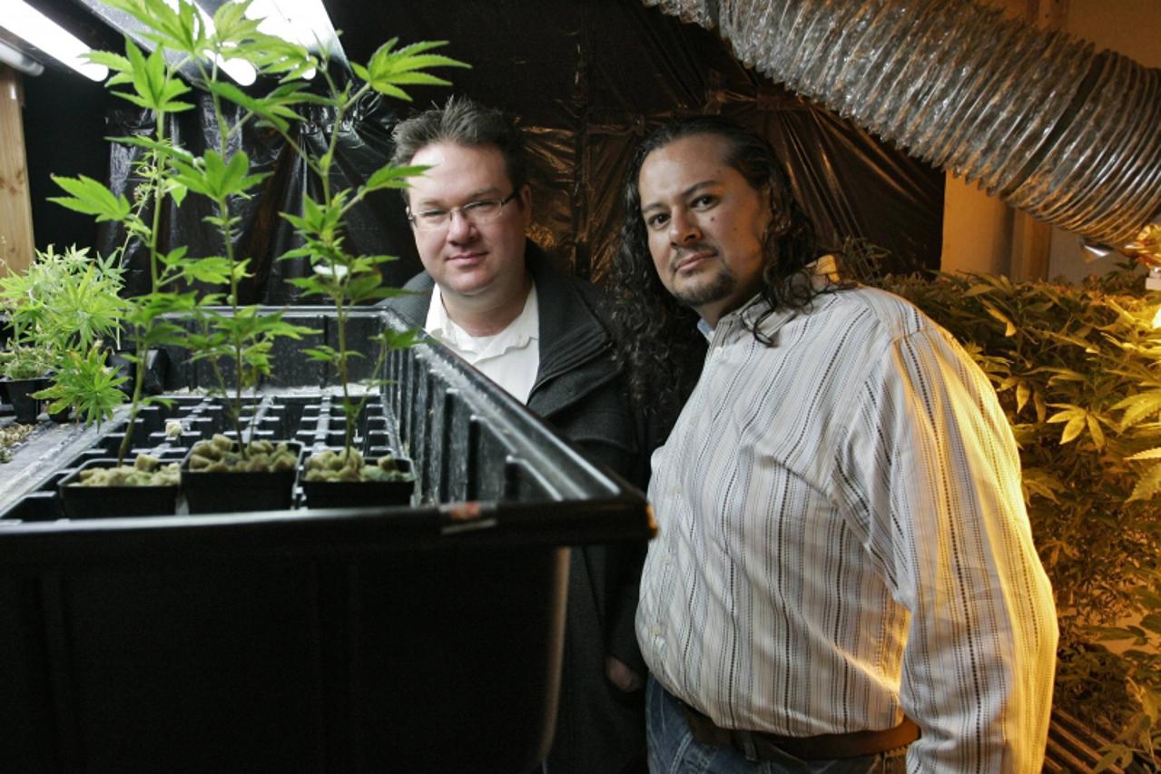 'Brennan Thicke (L), a founder of the Venice Beach Care Center, and Rigo Valdez, an organizing director with United Food and Commercial Workers union (UFCW), pose together at the medical marijuana dis