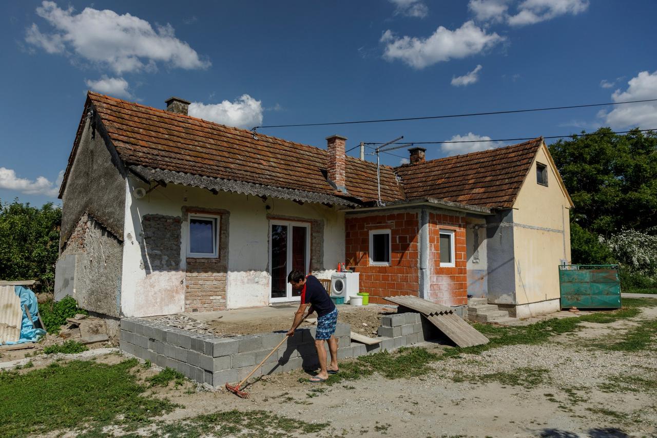 Danijel Harmnicar owner of house bought for 1 HRK works in yard in village Legrad