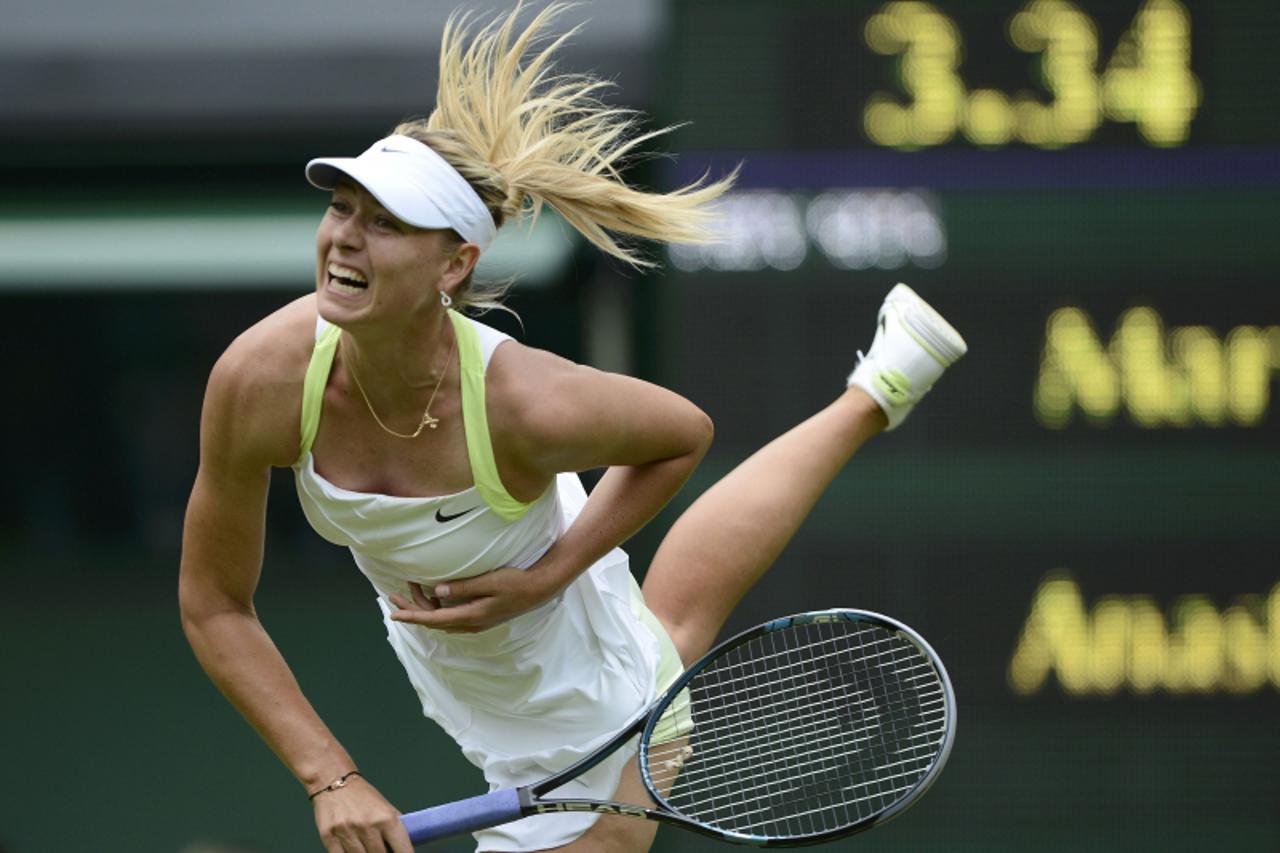 'Maria Sharapova of Russia serves to Anastasia Rodionova of Australia during their women's singles tennis match at the Wimbledon tennis championships in London June 25, 2012.           REUTERS/Dylan 