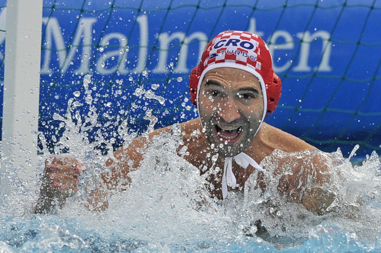 'Croatian goalkeeper Josip Pavic reacts after saving a shot from Serbia in the Mladost swimming pool of Zagreb on September 9, 2010 during their semifinal match at the European water polo championship