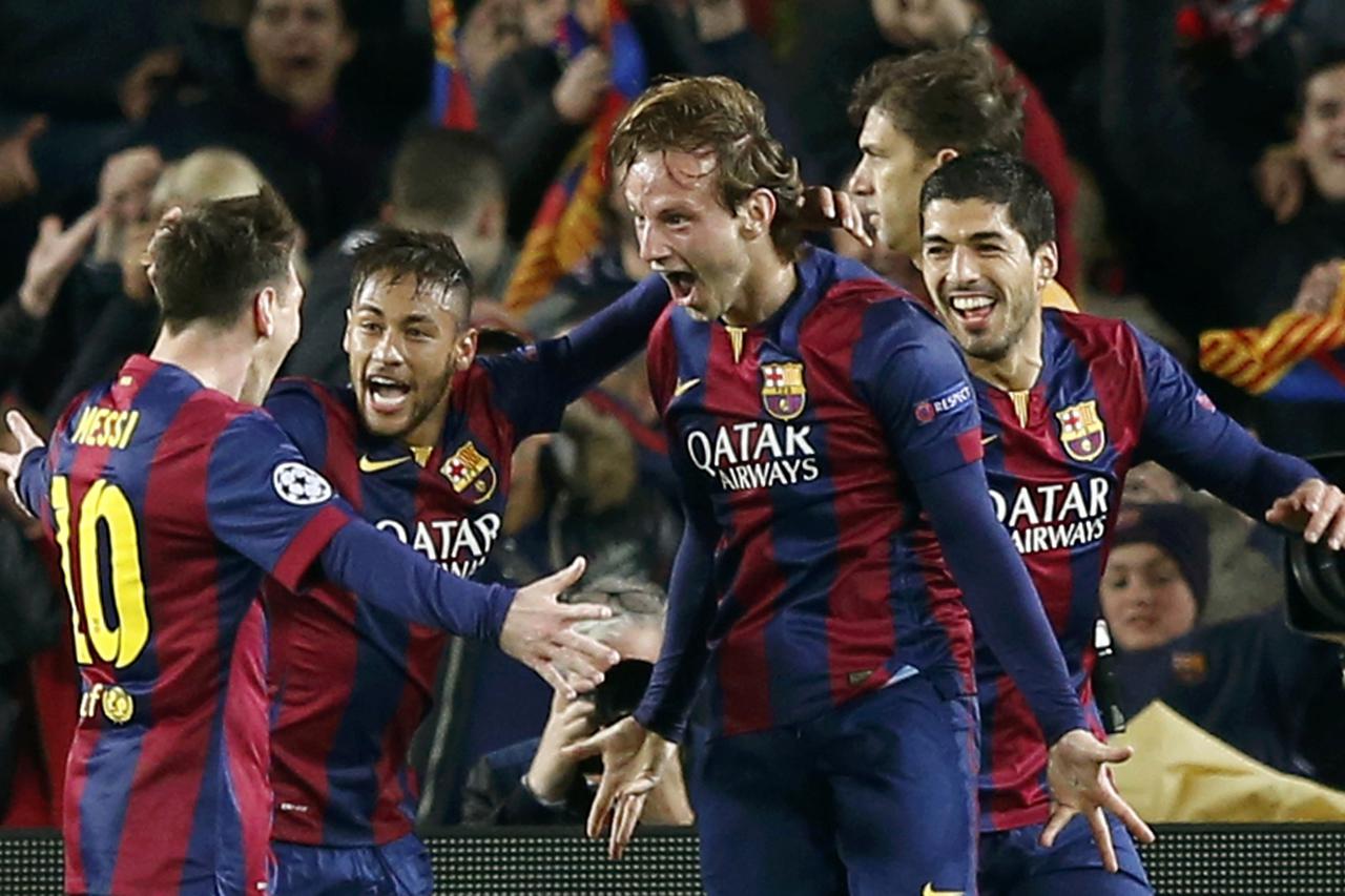 Barcelona's Ivan Rakitic (2ndR) is congratulated by his team mates Lionel Messi (L), Neymar and Luis Suarez (R) after scoring a goal against Manchester City during their Champions League round of 16 second leg soccer match at Camp Nou stadium in Barcelona