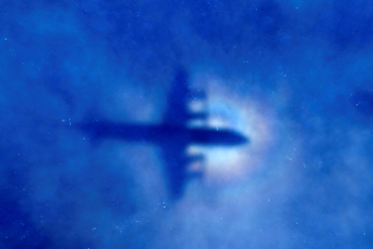 FILE PHOTO: The shadow of a Royal New Zealand Air Force (RNZAF) P3 Orion maritime search aircraft can be seen on low-level clouds as it flies over the southern Indian Ocean looking for missing Malaysian Airlines flight MH370