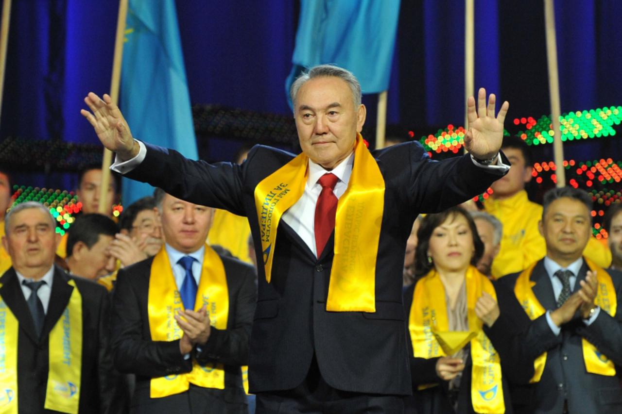 \'Kazakh President Nursultan Nazarbayev (C) greets his supporters during a celebration rally at a sports center in Astana, on April 4, 2011. Nazarbayev extended his rule over Kazakhstan into a third d