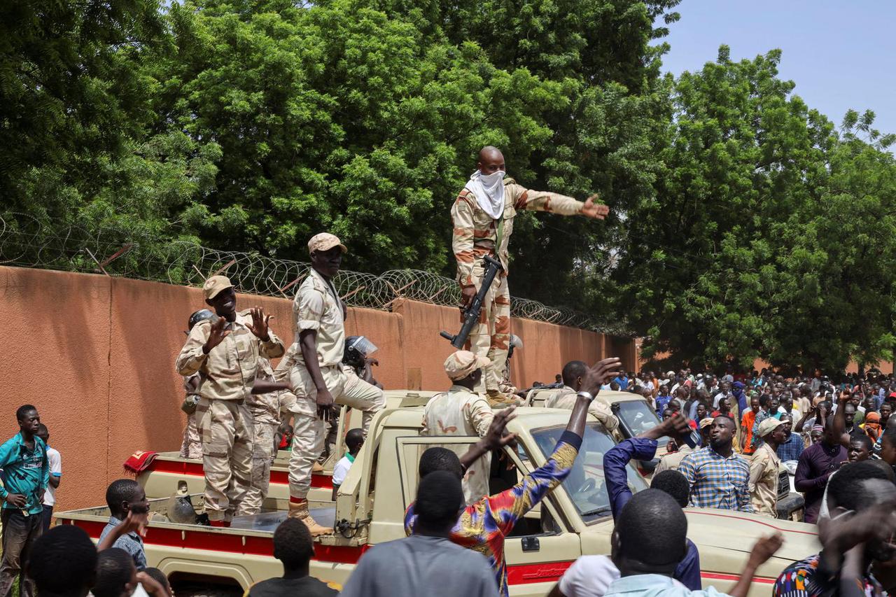 Pro-junta protesters gather outside the French Embassy in Niamey