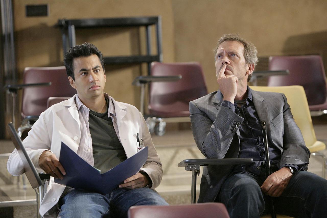 HOUSE:  House (Hugh Laurie, R) and Dr. Kutner (Kal Penn, L) listen to Foreman when he returns to the hospital and is assigned to oversee the team candidates in the HOUSE episode 