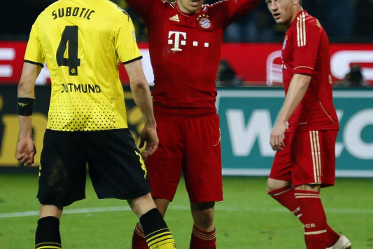 'Arjen Robben of Bayern Munich reacts after missing the chance to score with a penalty against Borussia Dortmund during their German first division Bundesliga soccer match in Dortmund, April 11, 2012.