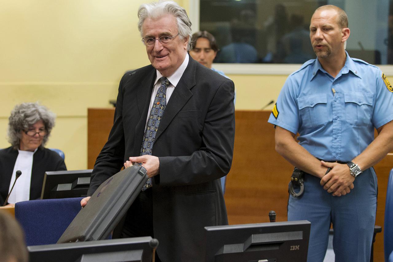 Bosnian Serb wartime leader Radovan Karadzic appears in the courtroom for his appeals judgement at the International Criminal Tribunal for Former Yugoslavia (ICTY) in The Hague, in this July 11, 2013 file photo. REUTERS/Michael Kooren/Files