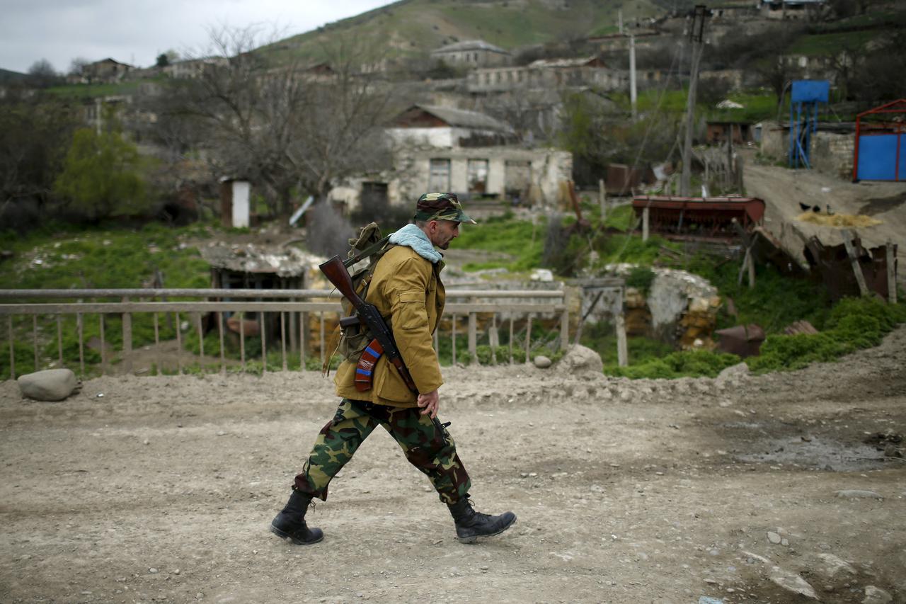 A volunteer walks on a road in the Nagorno-Karabakh's village of Talish April 6, 2016. (Photo by Reuters/Staff)