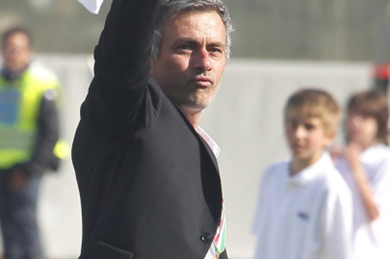 'Inter Milan\'s coach Jose Mourinho celebrates after his team won the Italian Serie A title on May 16, 2010 in Siena. Inter Milan secured a fifth straight Serie A title after Diego Milito scored the o