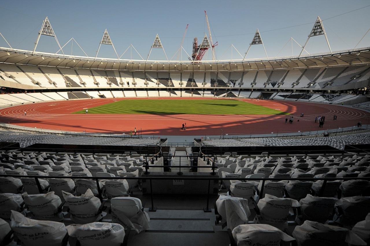 \'The London 2012 Olympics running track is seen following its unveiling in the Olympic Stadium in east London, on October 3, 2011. The 80,000-capacity stadium, situated in London\'s East End, is expe