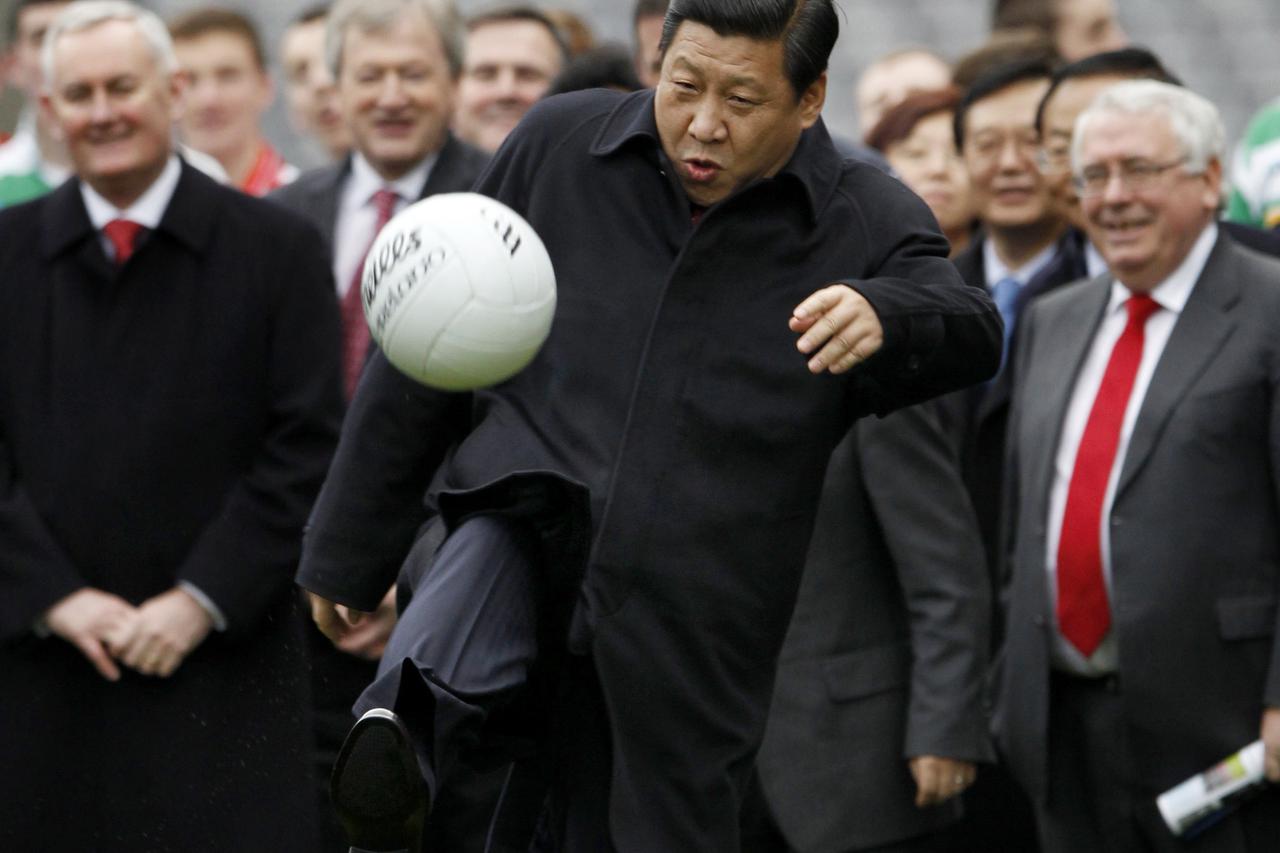 China's Vice-President Xi Jinping kicks a football during a visit to Croke Park in Dublin, Ireland February 19, 2012. REUTERS/David Moir (IRELAND - Tags: POLITICS SPORT SOCCER TPX IMAGES OF THE DAY) Picture Supplied by Action Images