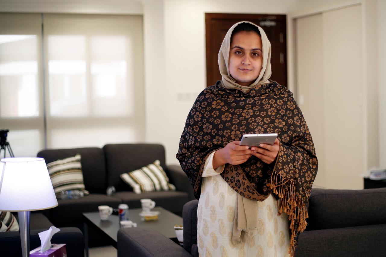 Afghan news anchor Beheshta Arghand poses for a photo at a temporary residence compound in Doha