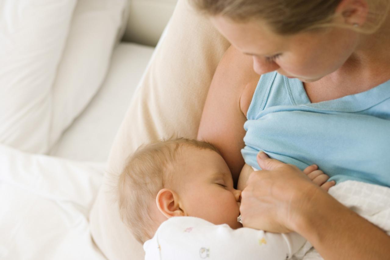 'Mother breastfeeding child'
