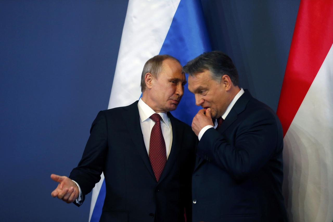 Russian President Vladimir Putin discuss with Hungarian Prime Minister Viktor Orban (R) before a joint news conference in Budapest February 17, 2015. Putin will discuss Russian gas supplies to Hungary when he visits Budapest on Tuesday, an adviser to the 