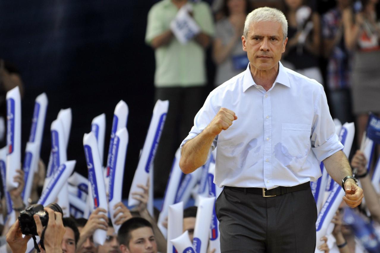 \'Serbia\'s incumbent President Boris Tadic gestures in front of supporters of the Democratic Party, during a rally in Belgrade, on May 2, 2012. Serbia\'s incumbent President Boris Tadic brought Serbi