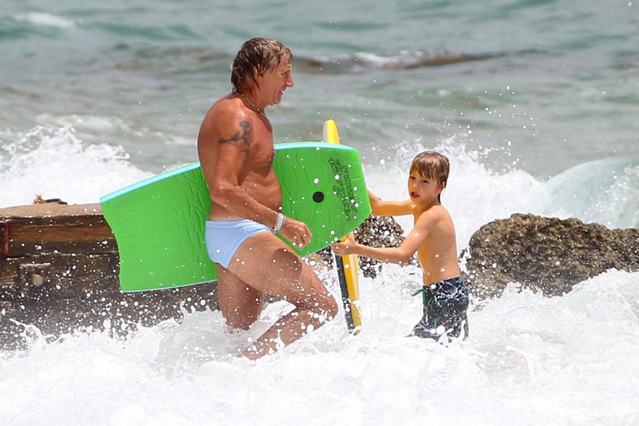 'Image: 0139439323, License: Rights managed, 50852650 Singer Rod Stewart enjoys the beach of Miami, Florida with his family, wife Penny Lancaster and son Alastair on August 7th, 2012. Rod even did a l