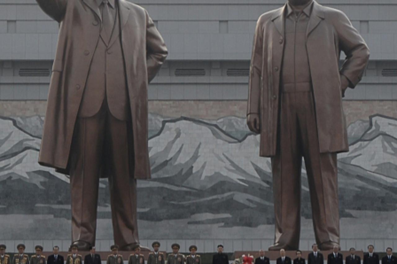 'North Korean leader Kim Jong-Un (C) attends the unveiling ceremony of two statues of former leaders Kim Il-Sung and Kim Jong-Il in Pyongyang on April 13, 2012. North Korea's new leader Kim Jong-Un o