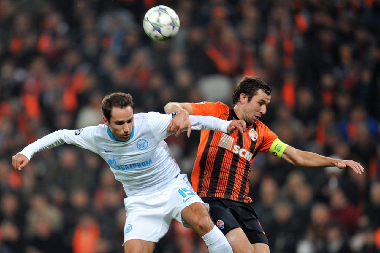 \'Darijo Srna   (  R )  of FC Shakhtar  fights for a ball with Roman Shirokov  (L  )of  FC Zenit St Petersburg during UEFA Champions  League,  Group G  football match in Donetsk on October 19, 2011. A