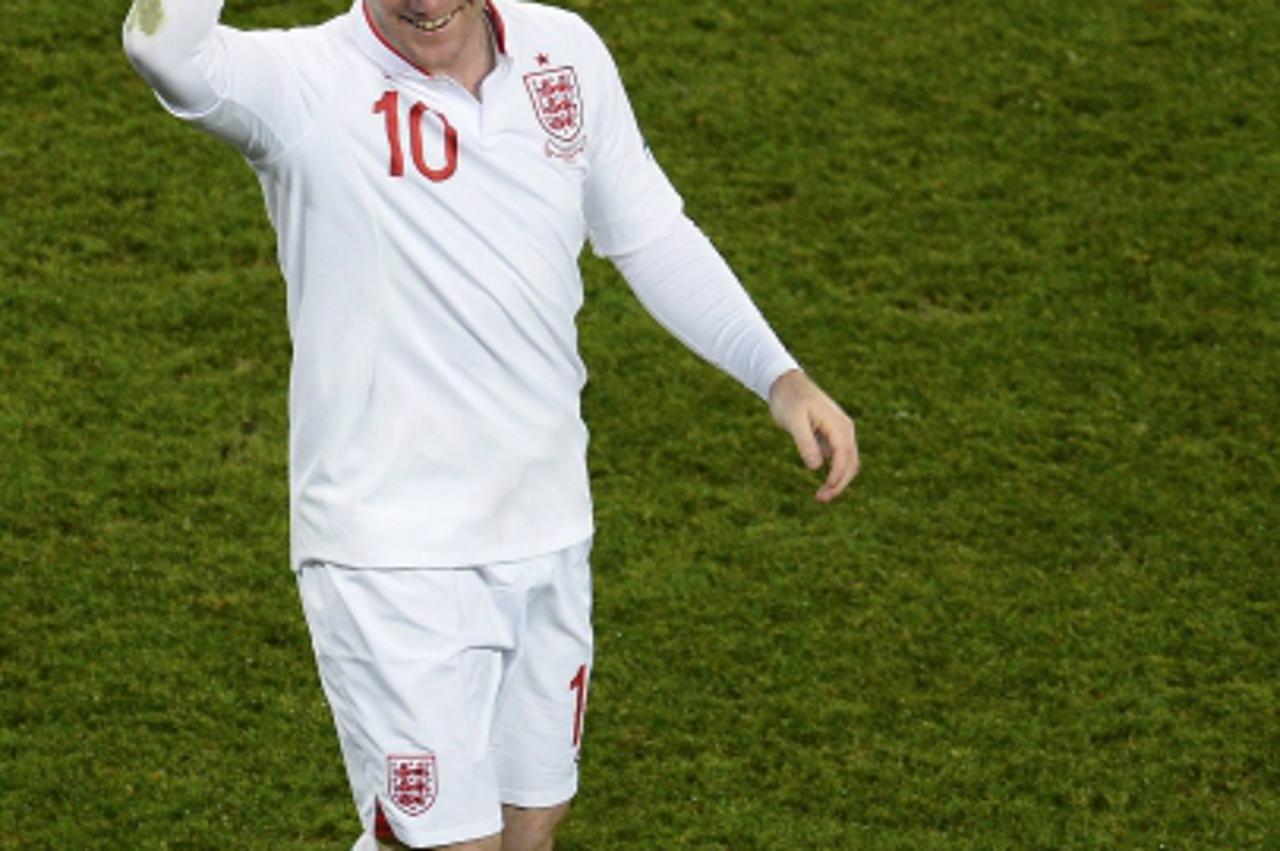 'England\'s Wayne Rooney celebrates after scoring a goal against Ukraine during their Group D Euro 2012 soccer match at Donbass Arena in Donetsk June 19, 2012.                REUTERS/Felix Ordonez (UK